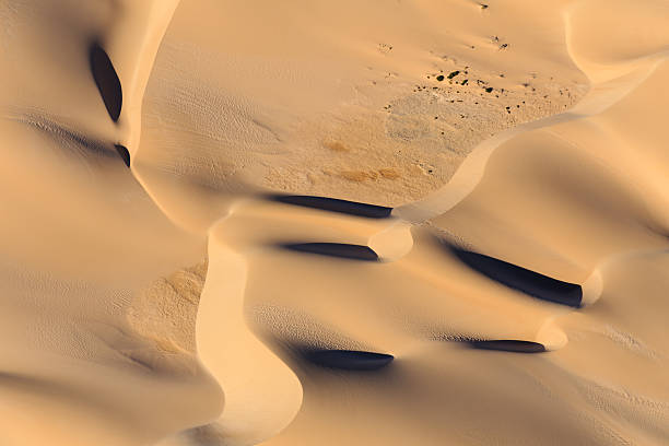 istock Patterns in the Sand Dunes Viewed from Above Displaying Shapes 593297254