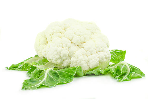 istock Cauliflower with green leaves isolated on white background 593298542