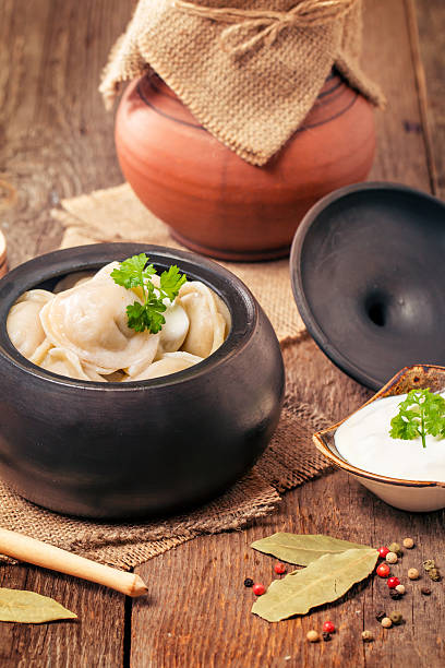 istock Meat Dumplings - russian pelmeni with sour cream 593301400