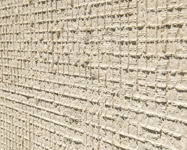 istock cement white  light  wall stucco  backgrounds surface fog 593301922