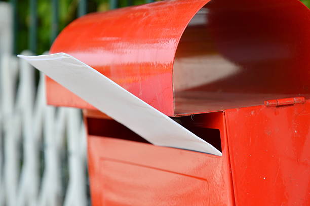 istock letter in red post box on home fence 593302504