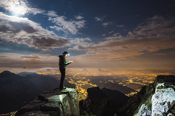 istock Hiker checks your device on top on the mount 593303004