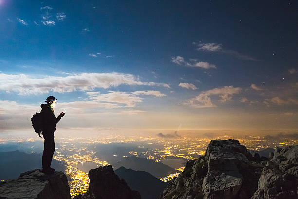 istock Hiker checks your device on top on the mount 593303006