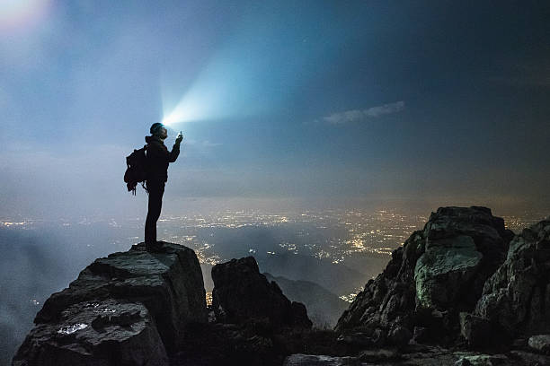 istock Hiker checks your device on top on the mount 593303040
