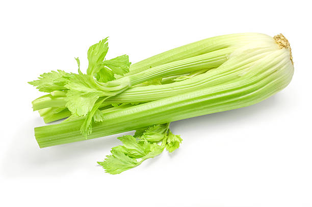 istock Bunch of celery sticks isolated on the white background 593303324