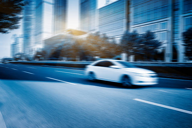istock car driving on road in city 593303518
