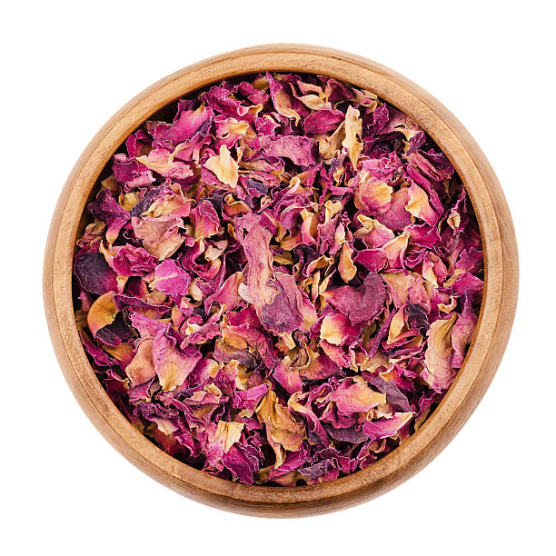 istock Rose petals in a bowl over white 593304486