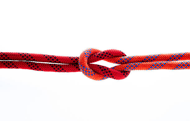 istock Rope with reef knot isolated on white background 593304622