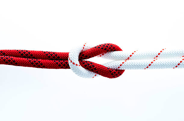 istock Rope with reef knot isolated on white background 593304736