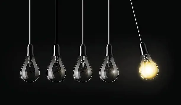 Vector illustration of Glowing light bulb, concept idea, perpetual Motion concept, Newton's cradle