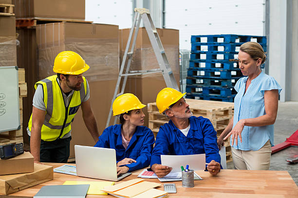 istock Warehouse worker listening to their manager 593305086