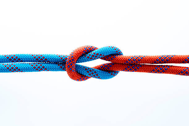 rope with reef knot isolated on white background - nylon strings imagens e fotografias de stock