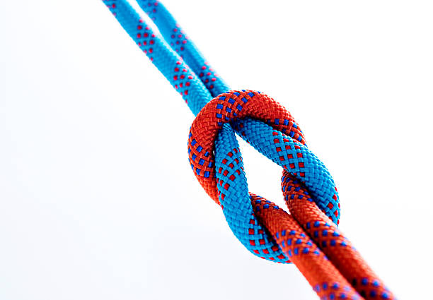 istock Rope with reef knot isolated on white background 593305410