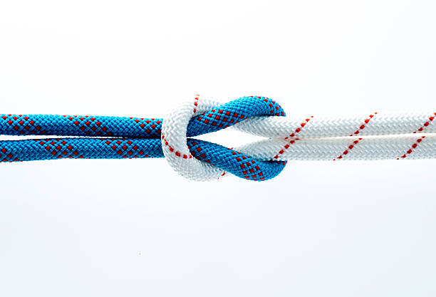 istock Rope with reef knot isolated on white background 593305488