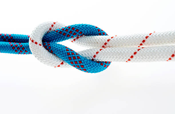 istock Rope with reef knot isolated on white background 593305650