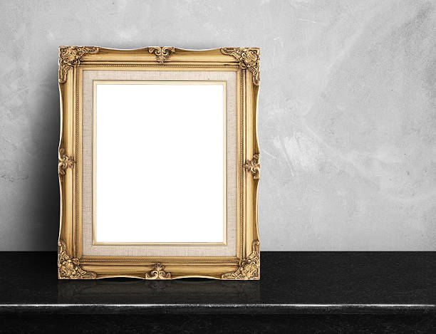 istock Blank Gold victorian picture frame on black marble table 593305774