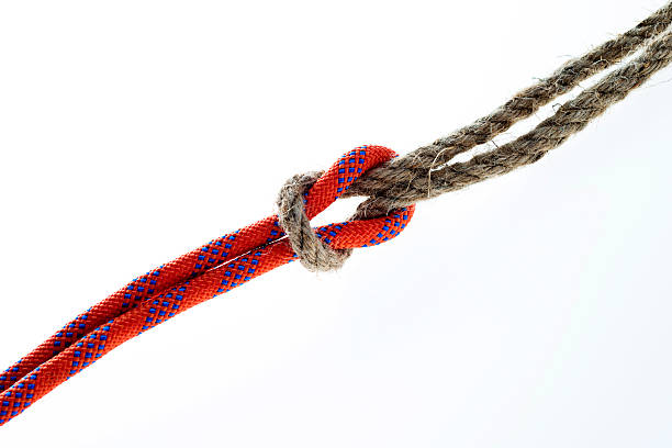 istock Rope with reef knot isolated on white background 593305788