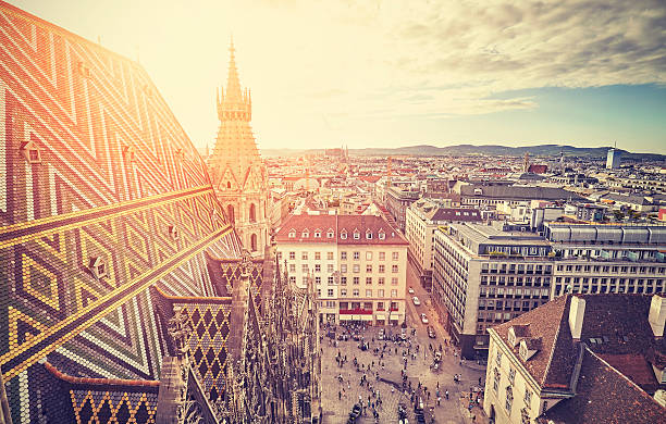 Retro stylized picture of Vienna at sunset. Retro stylized picture of Vienna at sunset, view from the north tower of St. Stephen's Cathedral, Austria. st. stephens cathedral vienna photos stock pictures, royalty-free photos & images