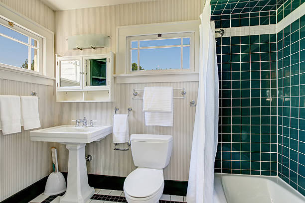 istock Bathroom with wooden panel walls and shower bath tub 593306392