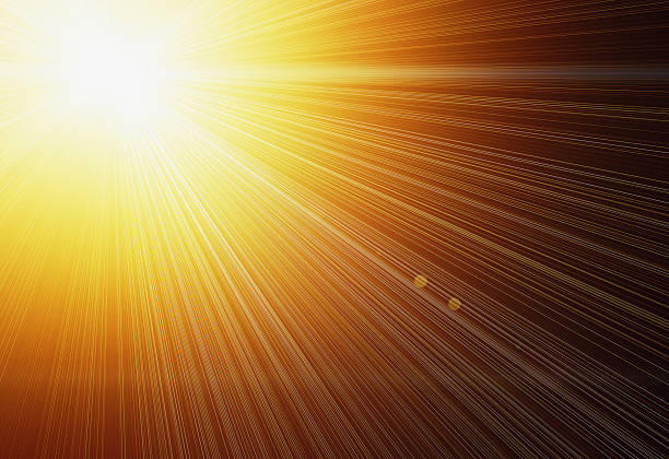 istock Dazzling starburst of golden rays against orange 593307598