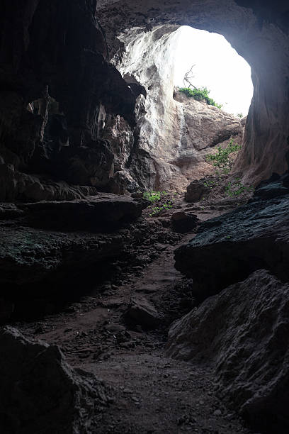 istock Large hole on ceiling of rocky cave 593307886