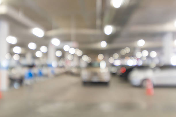 istock Abstract blurred indoor car park with light bokeh background 593309246
