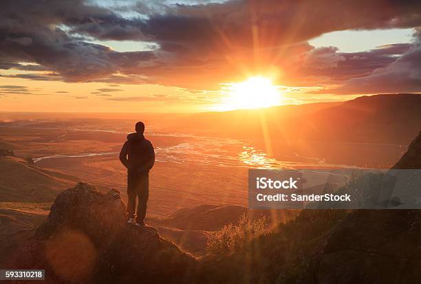 Looking At The Sun Stock Photo - Download Image Now - Mountain, Men, Sunset