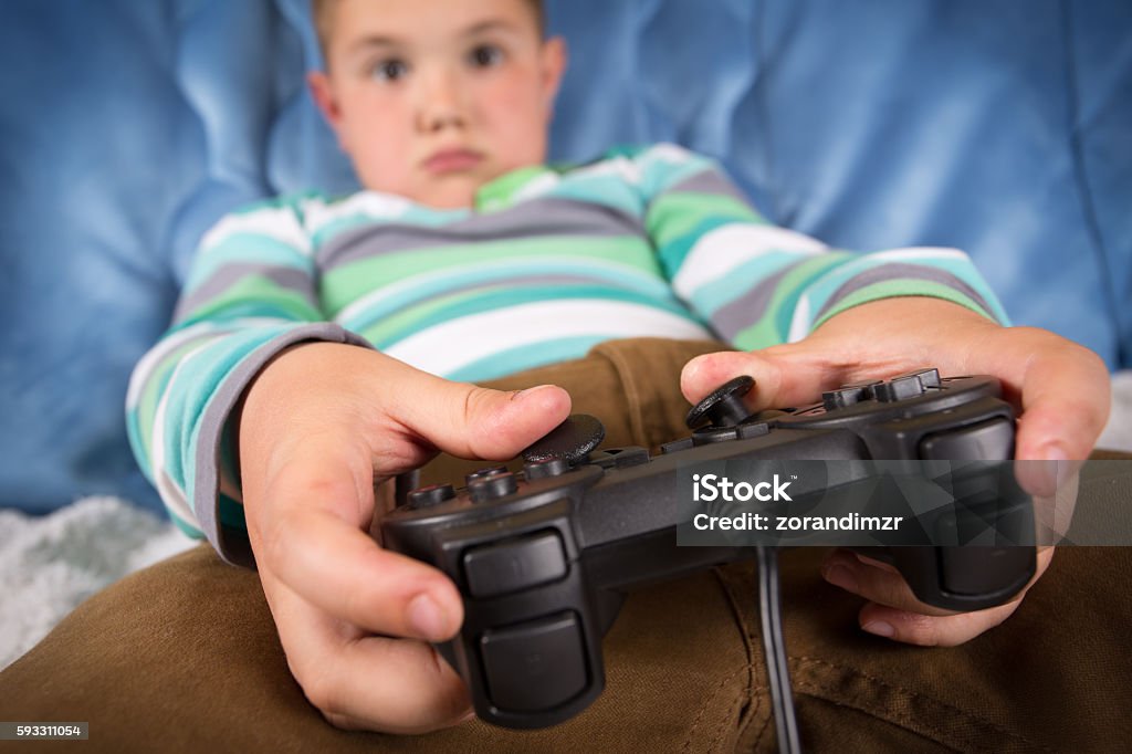 Kid Using Controller Boy Using Video Game Controller Stock Photo - Download Image Now - Boys ...