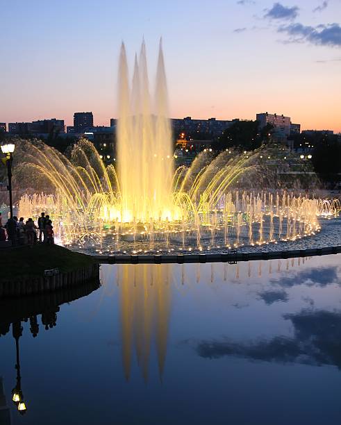 istock Couples admire the fountain. 593311428