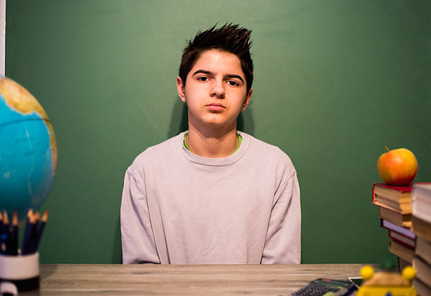 istock Studying with fun 12 years old children boy 593311546