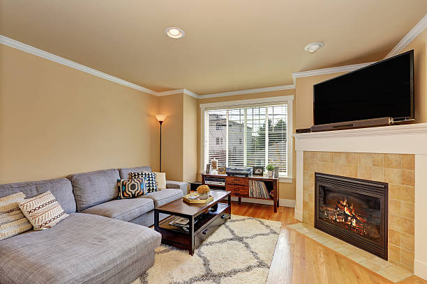 istock Small yet cozy family room with corner fireplace 593313082