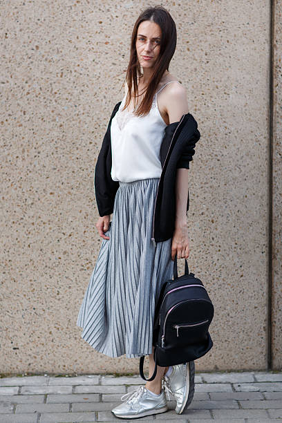 istock Brunette young woman student with backpack in casual style 593314246