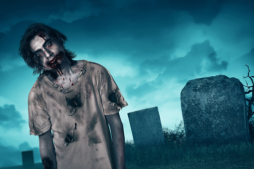 Zombie walking with creepy expression, graveyard and fog background