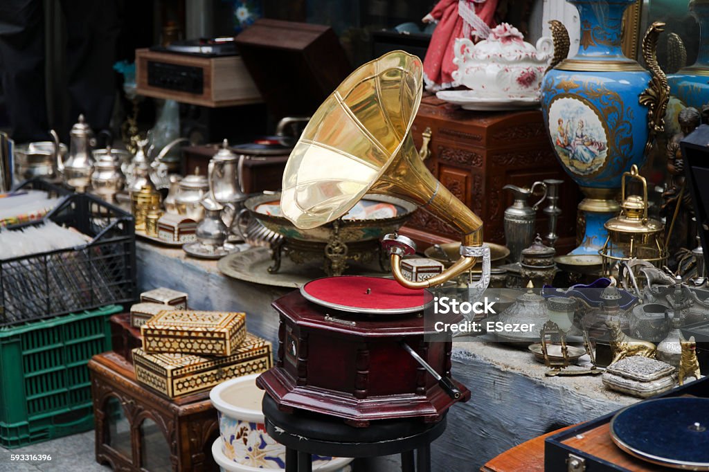 Old Gramophone and Other Antique Objects At Antiques Market An old gramophone and other antique objects at antiques market in street Antique Stock Photo
