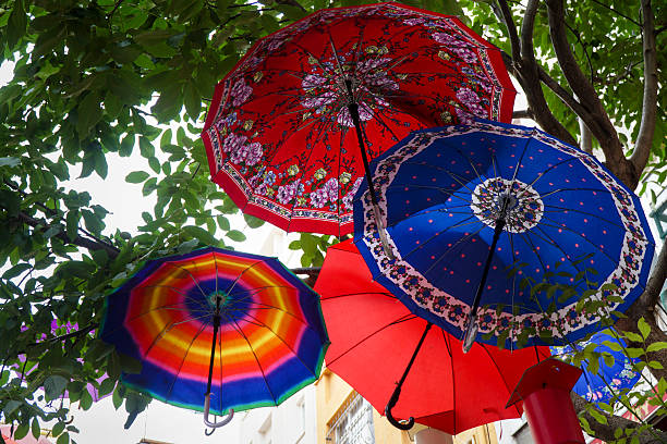 istock Tree Decorated With Colorful Umbrellas 593316484