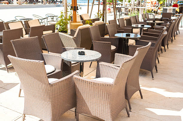 istock Row of small tables of a cafe 593317178