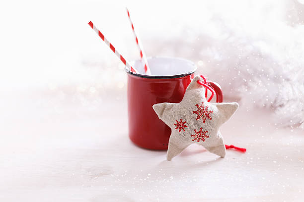 istock Christmas themed ornaments and red mug over white background 593317448