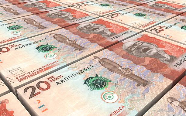 istock Stack of Colombian pesos bills stacks background. 593317698