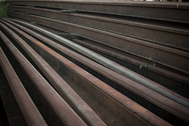 istock Steel tracks piled together beside the tracks 593318006