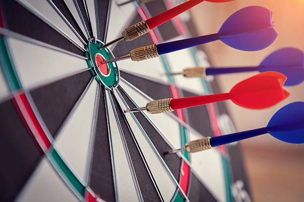istock Right on target concept using dart in the bullseye 593319292
