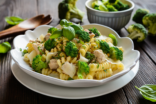 Macaroni pasta salad with fried chicken breast, steamed broccoli, cheese and basil