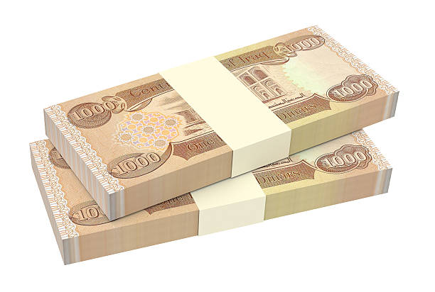 istock Iraq dinars bills isolated on white background. 593320188