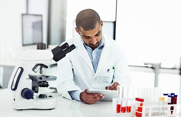 istock Keeping detailed logs of his experiments 593320360