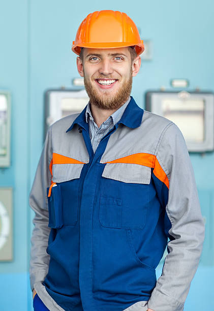 istock Portrait of young happy engineer in control room 593322964
