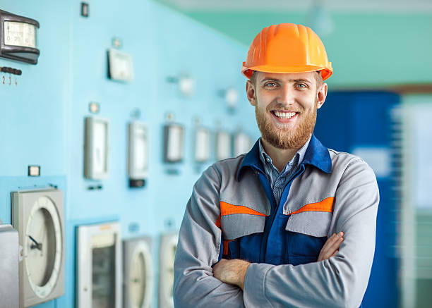istock Portrait of young happy engineer at control room 593323142