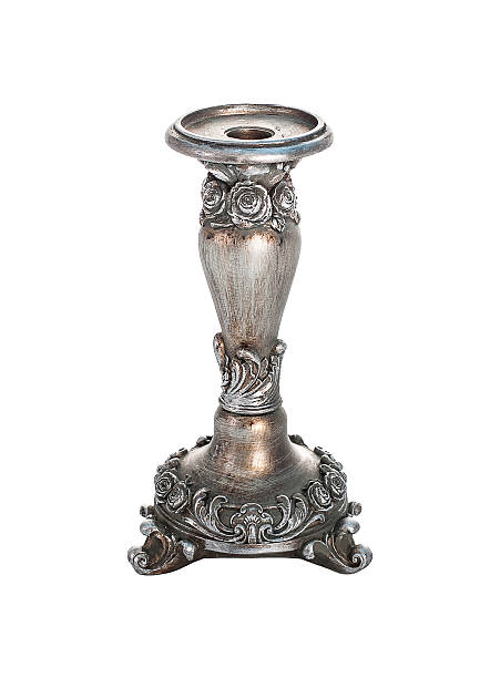 istock Ancient metal candlestick on a white background isolated 593323378