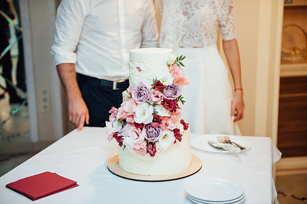 istock Beautiful delicious white wedding cake 593324330