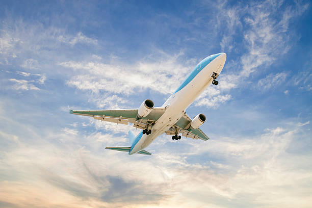 istock Airplane in the sky Good weather day background. 593325466