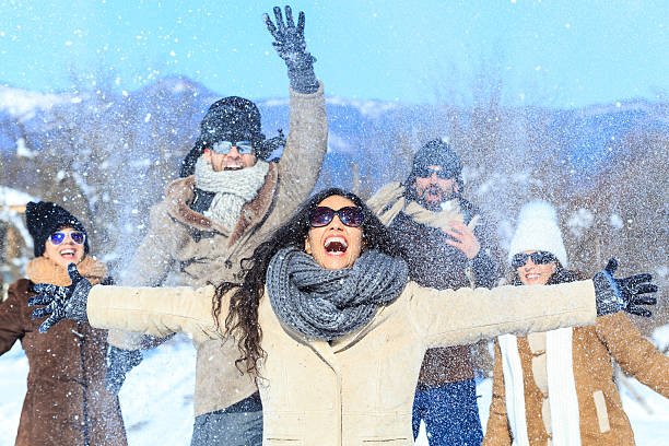 istock Group of young people having fun on snow mountain 593325566