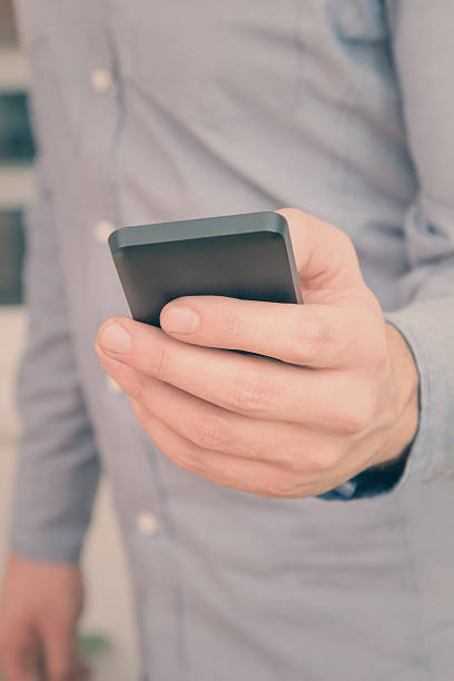 istock Urban guy / businessman with a cellphone. 593326130